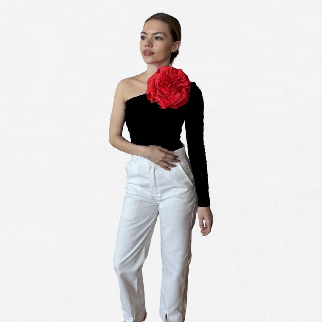 Black one sleeve top with red flower pin