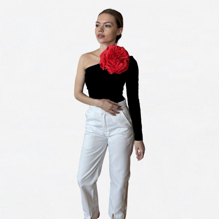 Black one sleeve top with red flower pin