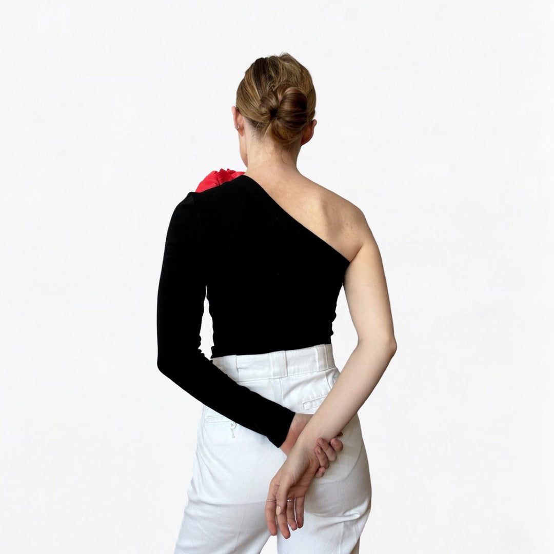 Black one sleeve top with red flower pin