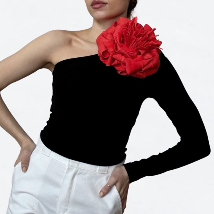 Black one sleeve top with red flower pin