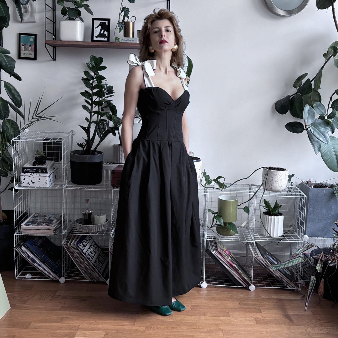 Black corset dress with contrasting trap ties