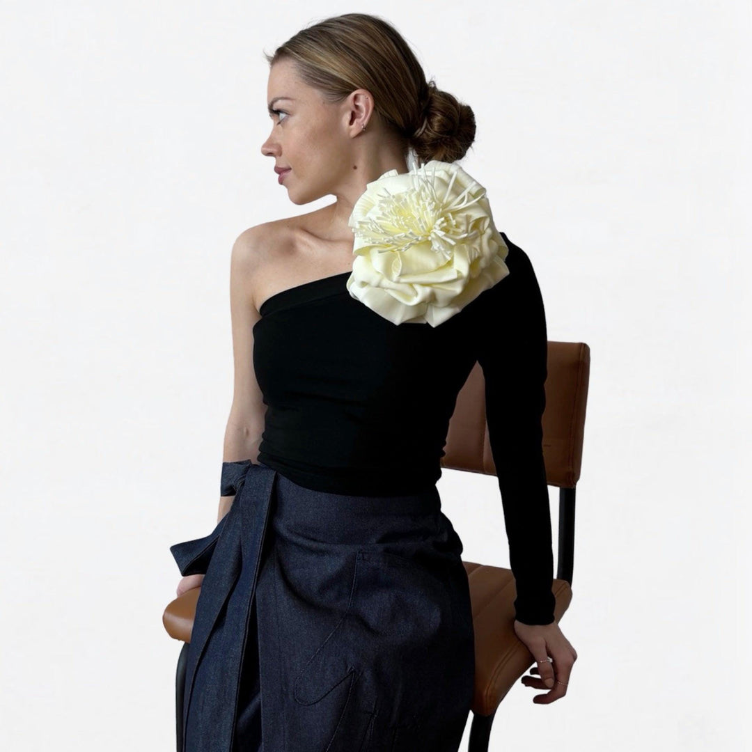 Black one sleeve top with white flower pin