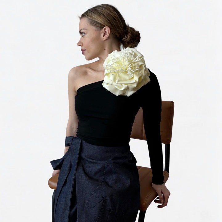 Black one sleeve top with white flower pin