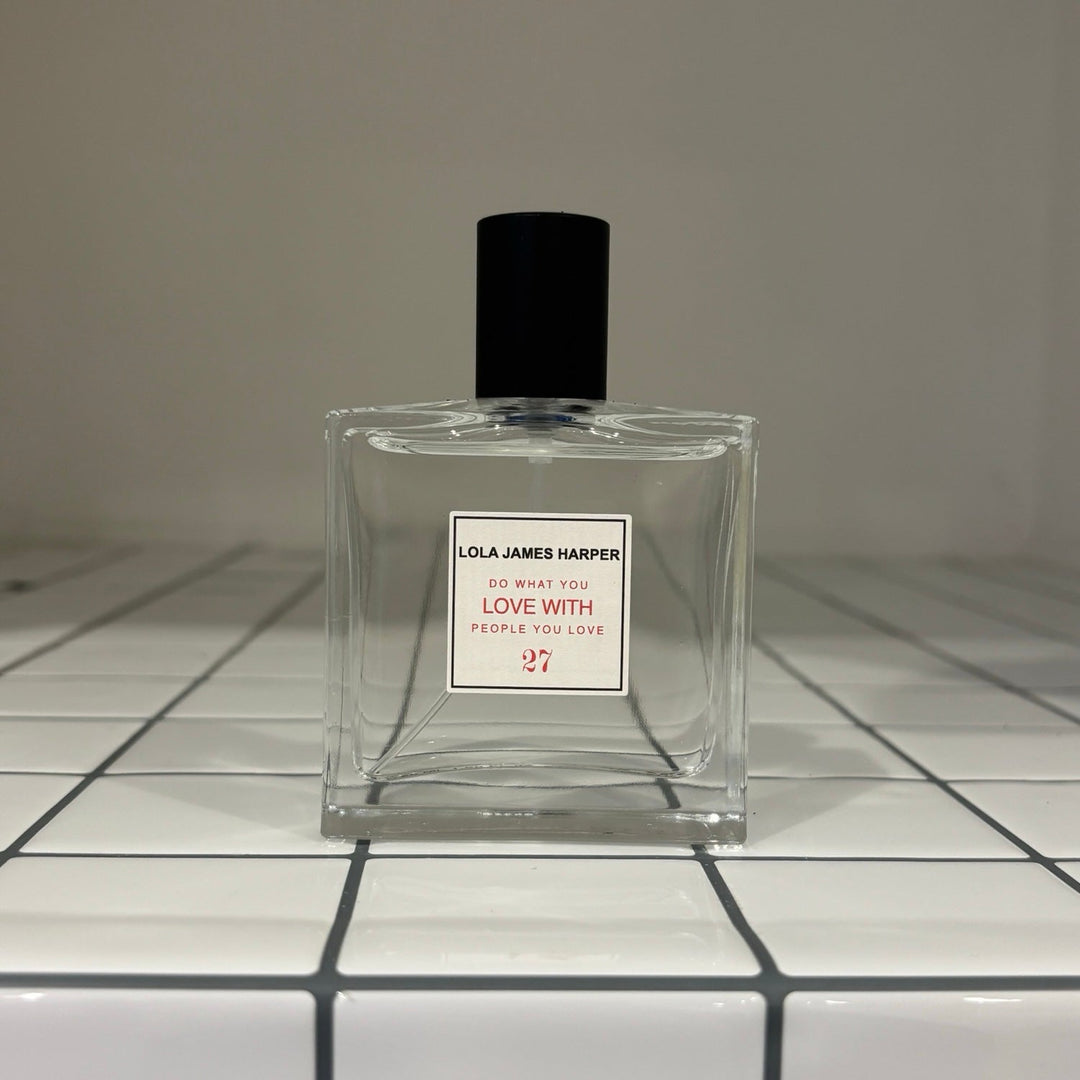 Fragrance bottle on white tiles