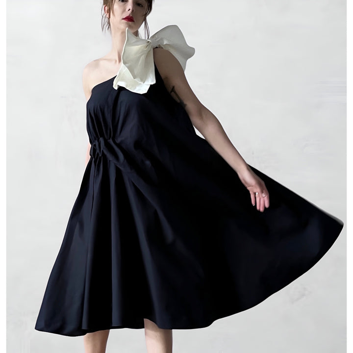 Navy cloche dress with one shoulder white bow