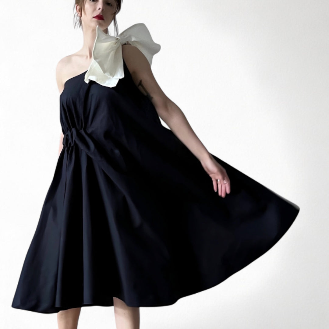 Navy cloche dress with one shoulder white bow