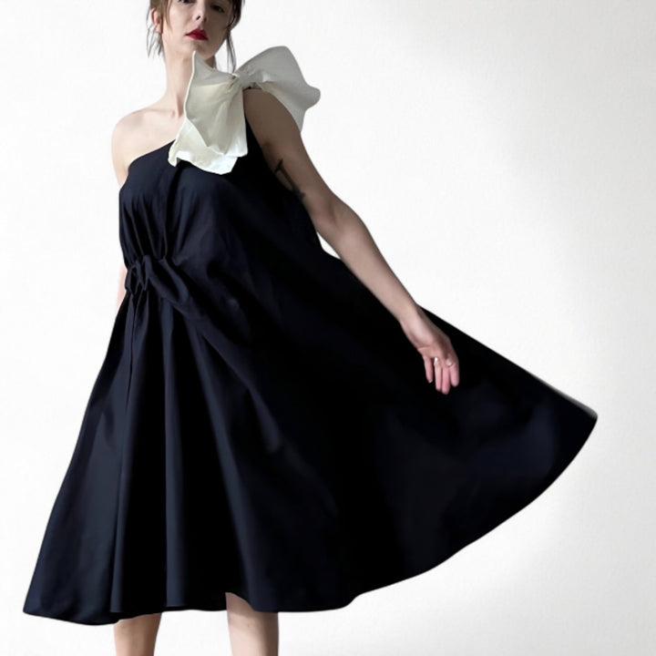 Navy cloche dress with one shoulder white bow