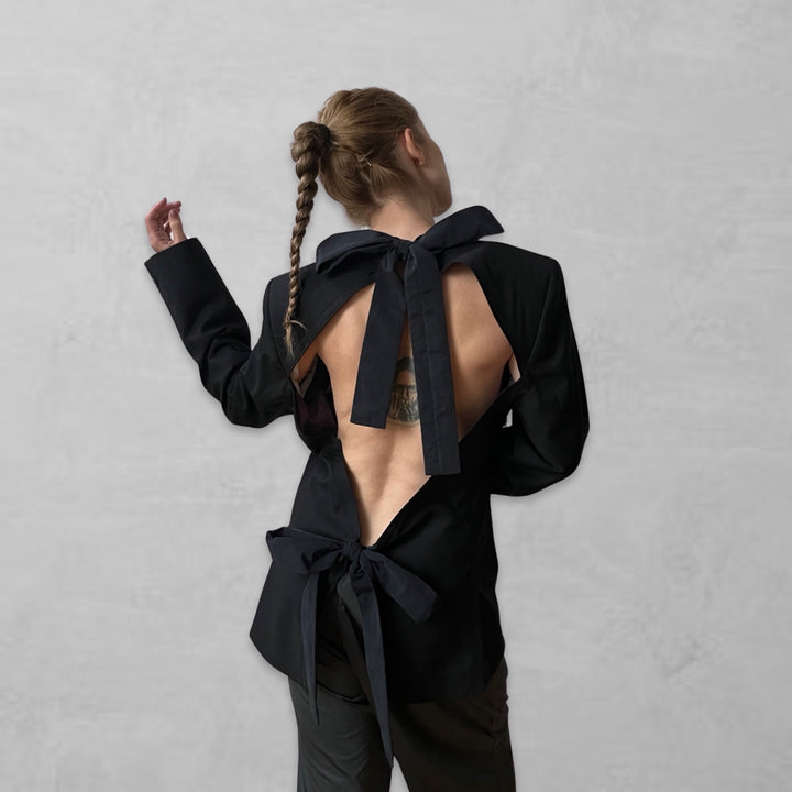 Reworked black blazer with open back and black bows