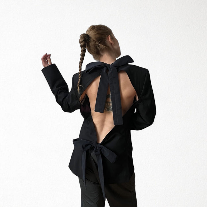 Reworked black blazer with open back and black bows