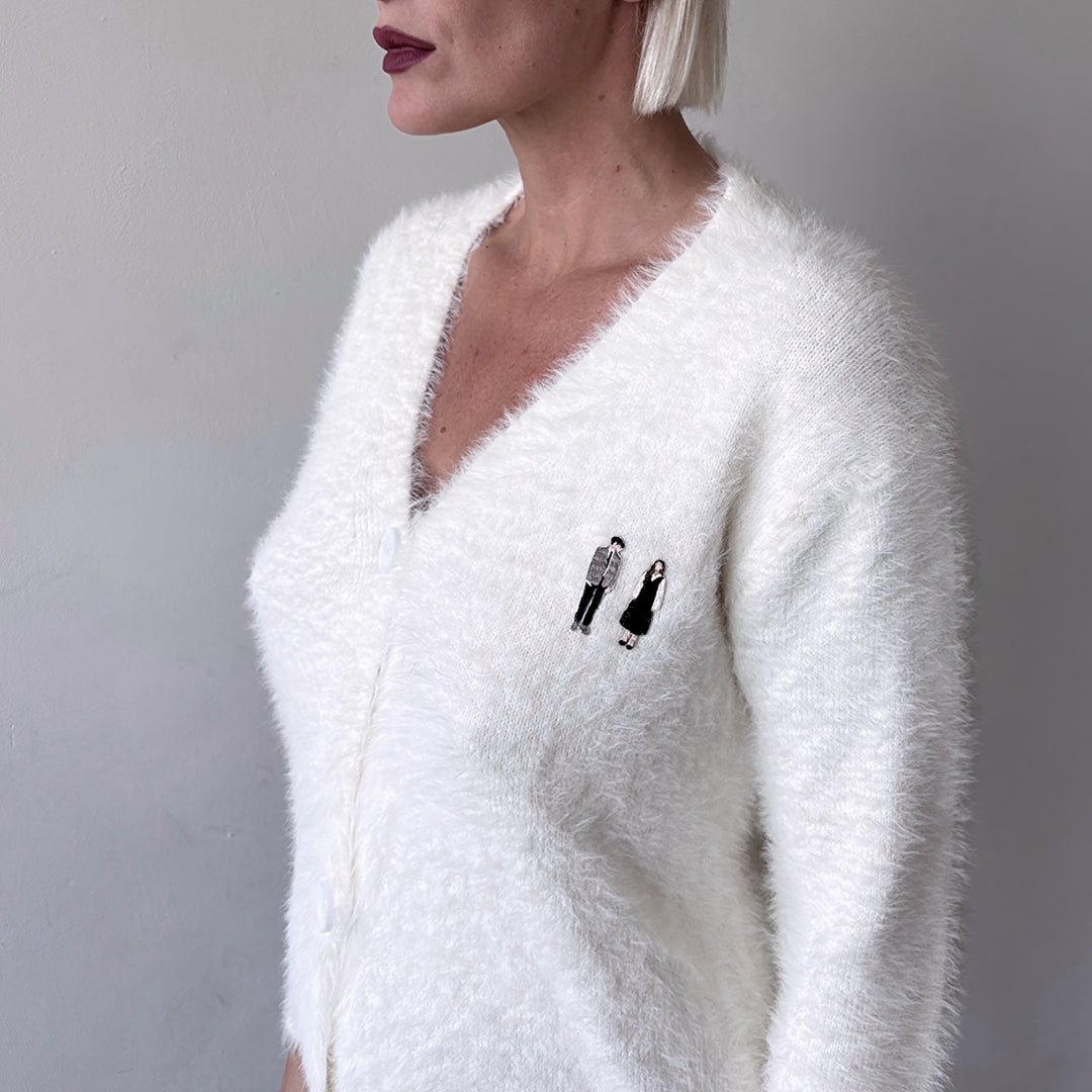 Beige fuzzy knit cardigan with embroidery patchess