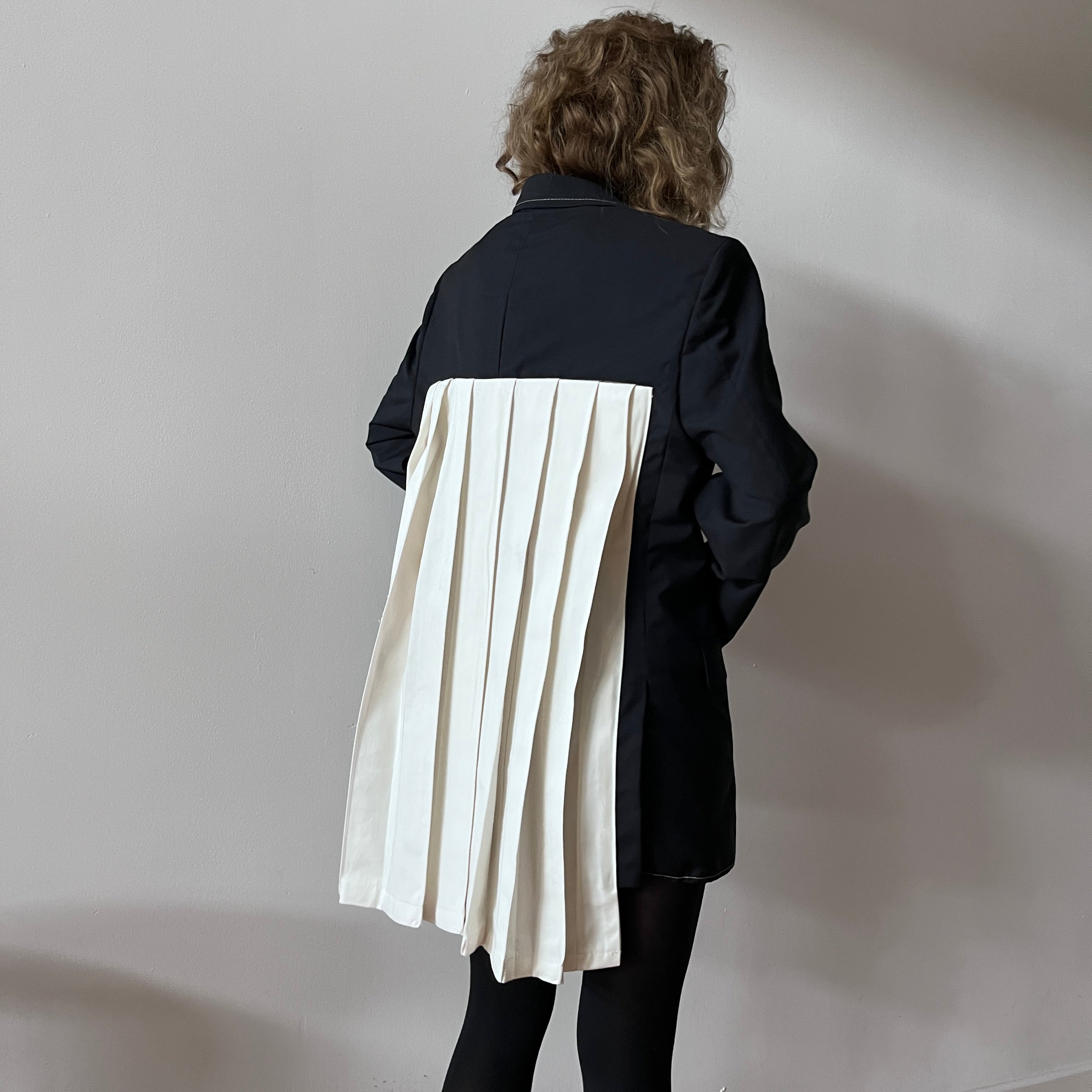 Reworked blazer with white pleated back appliqué