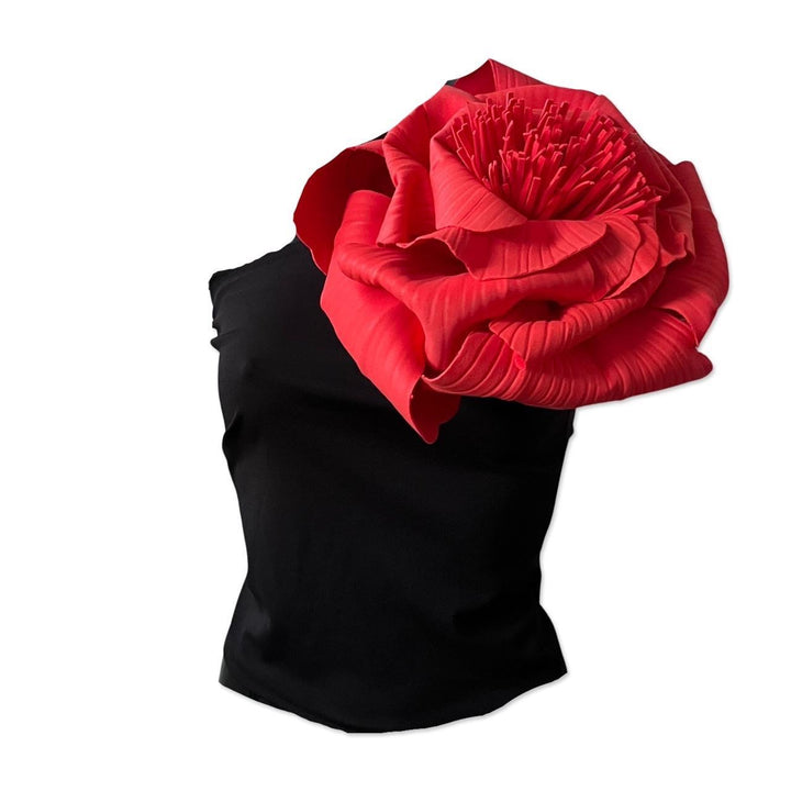 Black one shoulder top with red flower pin