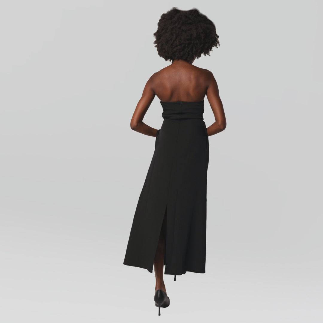 Black strapless dress with asymmetrical folds and pearl detail