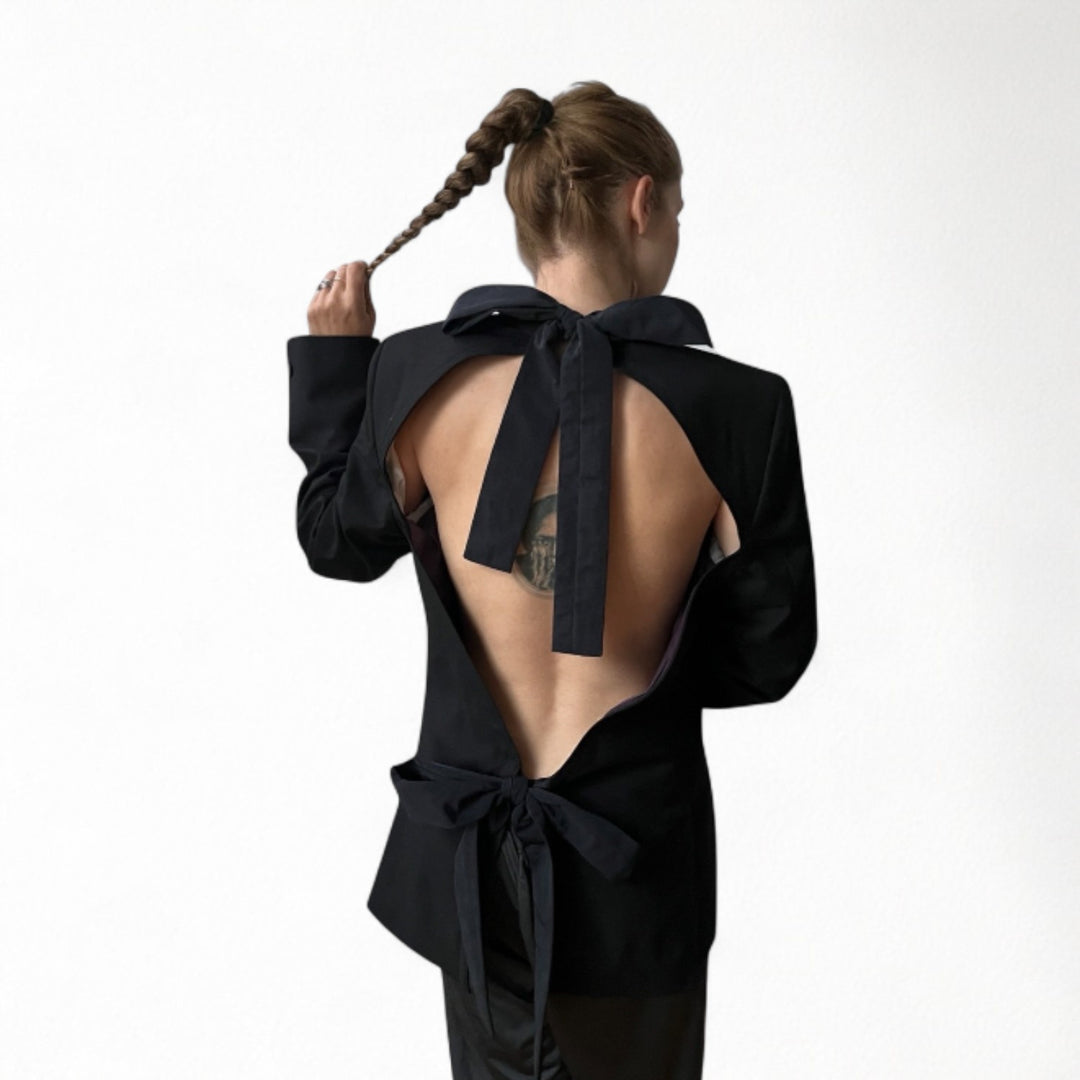 Reworked black blazer with open back and black bows