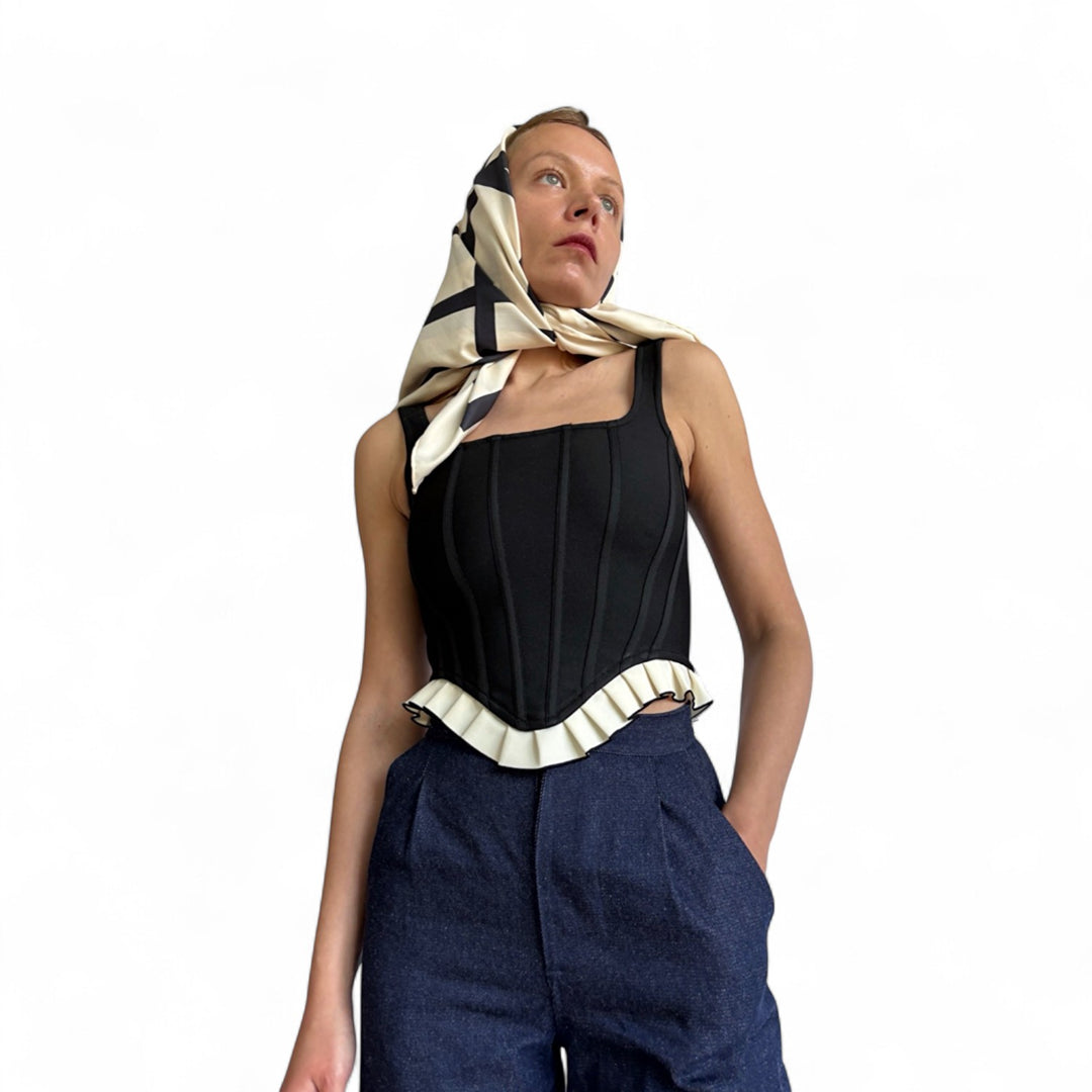 Black rib knit corset top with ruffle