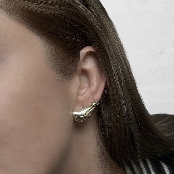 Gold earlobe cuff earrings