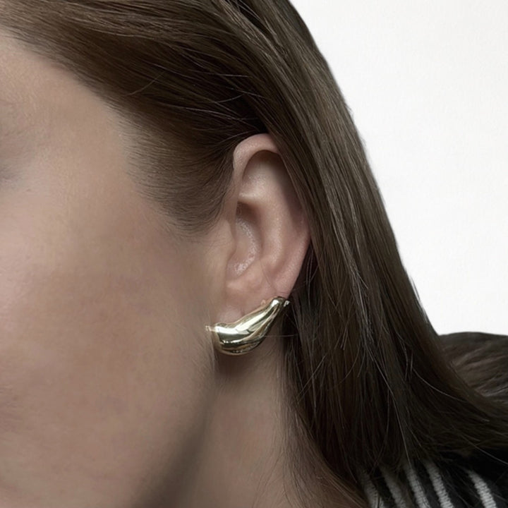 Gold earlobe cuff earrings