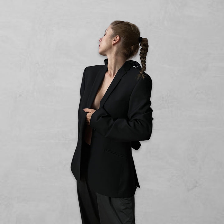 Reworked black blazer with open back and black bows