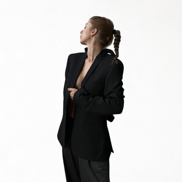 Reworked black blazer with open back and black bows