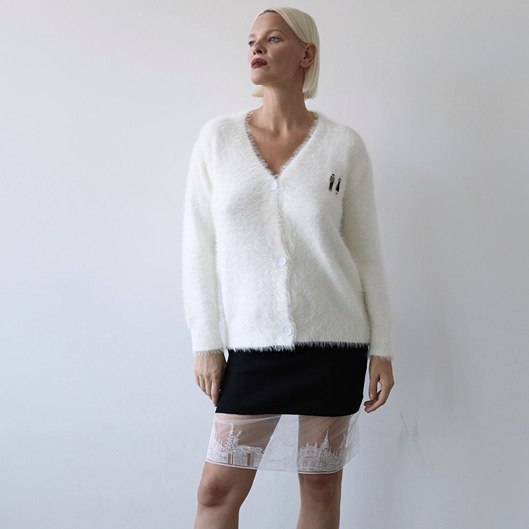 Beige fuzzy knit cardigan with embroidery patchess