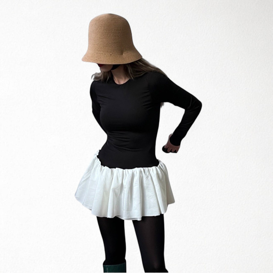 Black top with white balloon ruffle peplum
