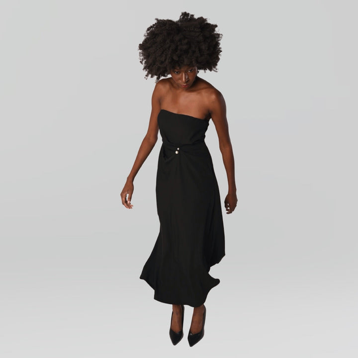 Black strapless dress with asymmetrical folds and pearl detail