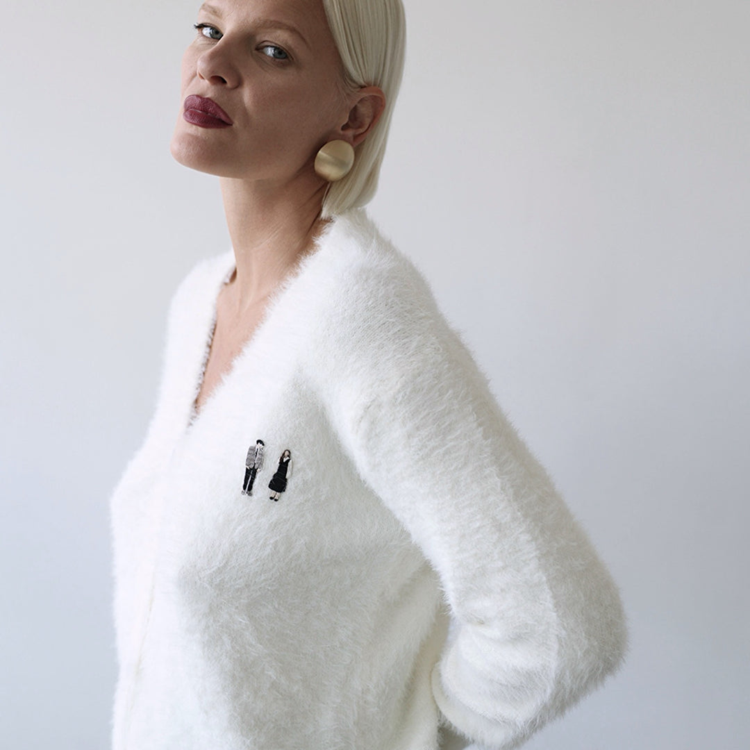 Beige fuzzy knit cardigan with embroidery patchess