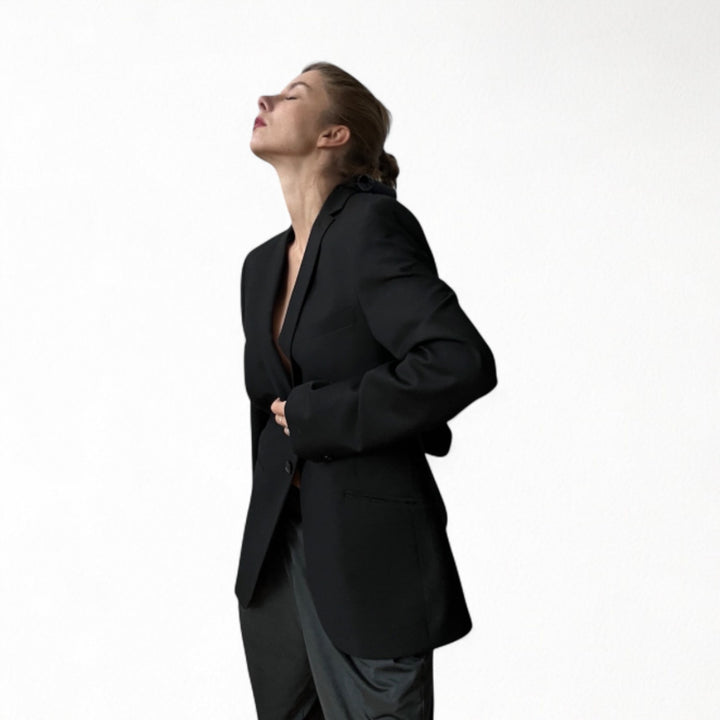 Reworked black blazer with open back and black bows