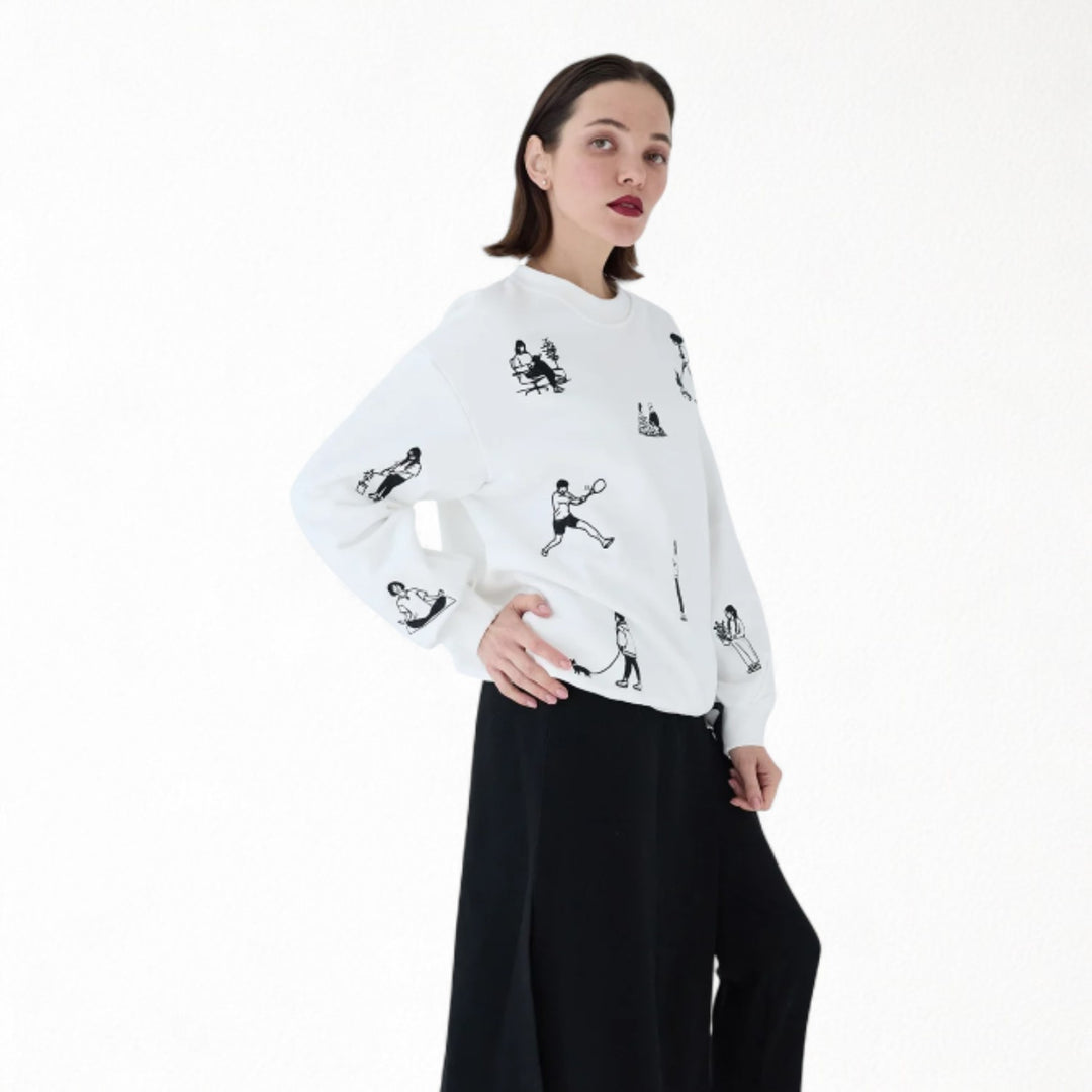 White heavyweight jumper with people embroidery