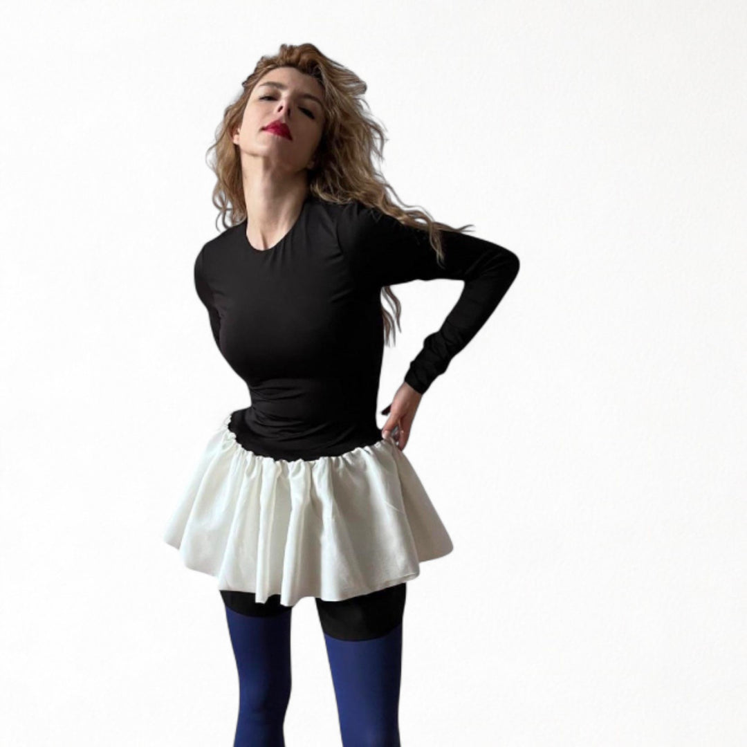 Black top with white balloon ruffle peplum