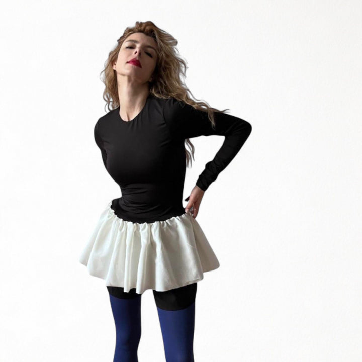 Black top with white balloon ruffle peplum