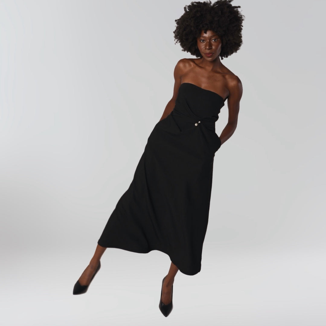 Black strapless dress with asymmetrical folds and pearl detail