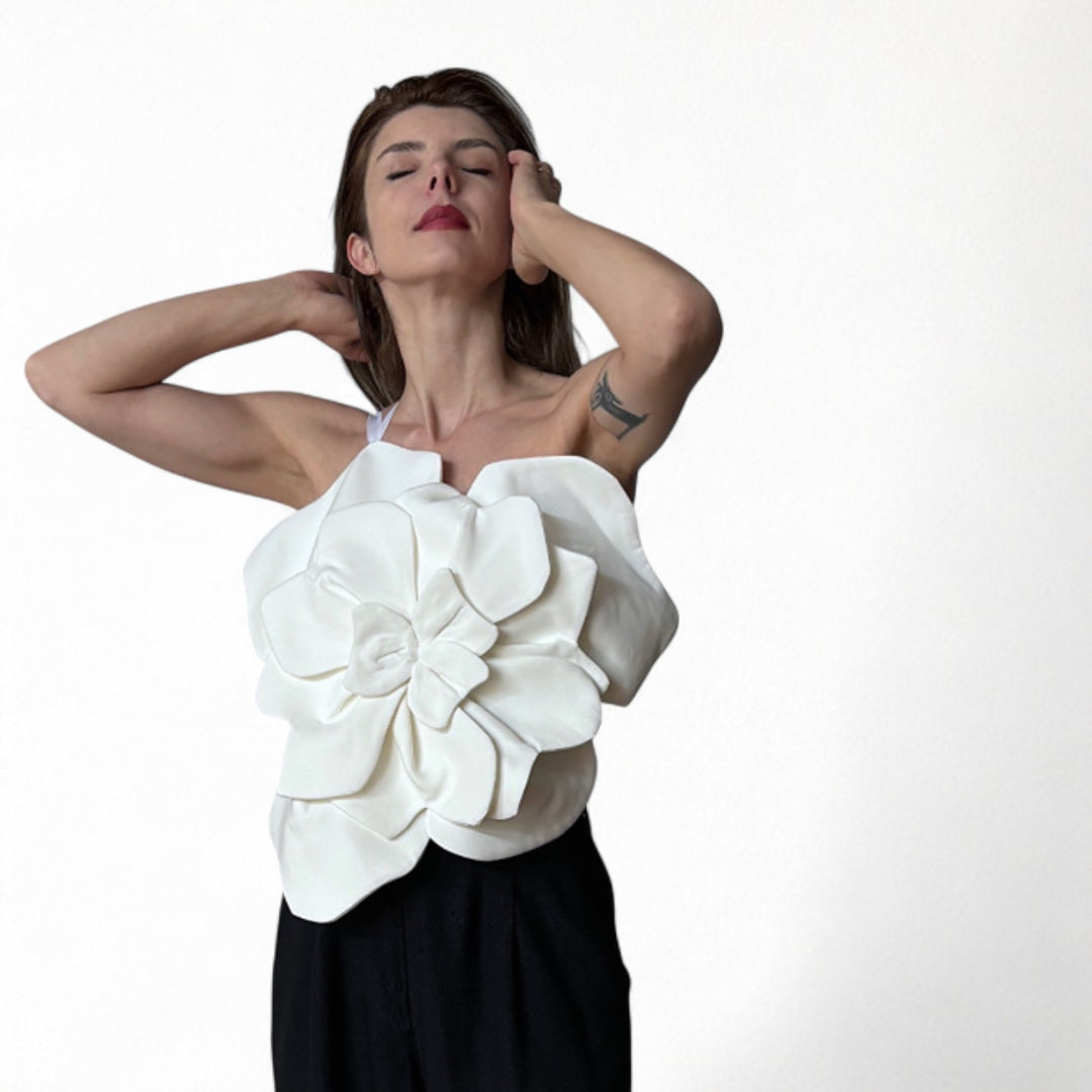 White flower top with asymmetric strap and criss cross back