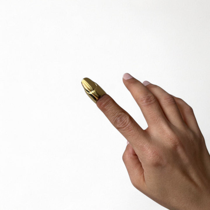 Gold finger cover with nail detail