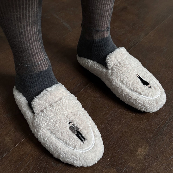 Beige shearling mules with embroidery patches