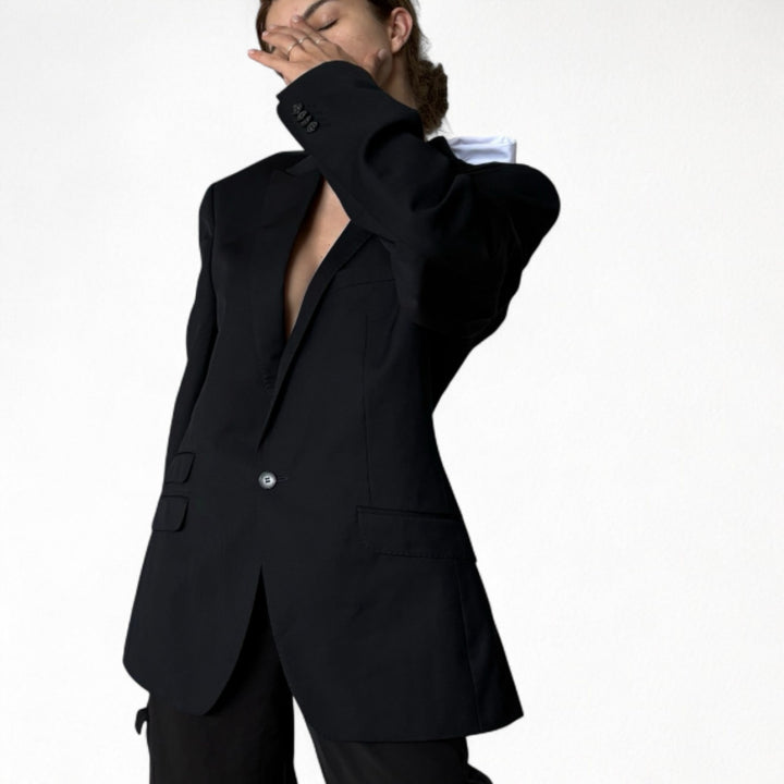 Reworked black blazer with open back and white bows