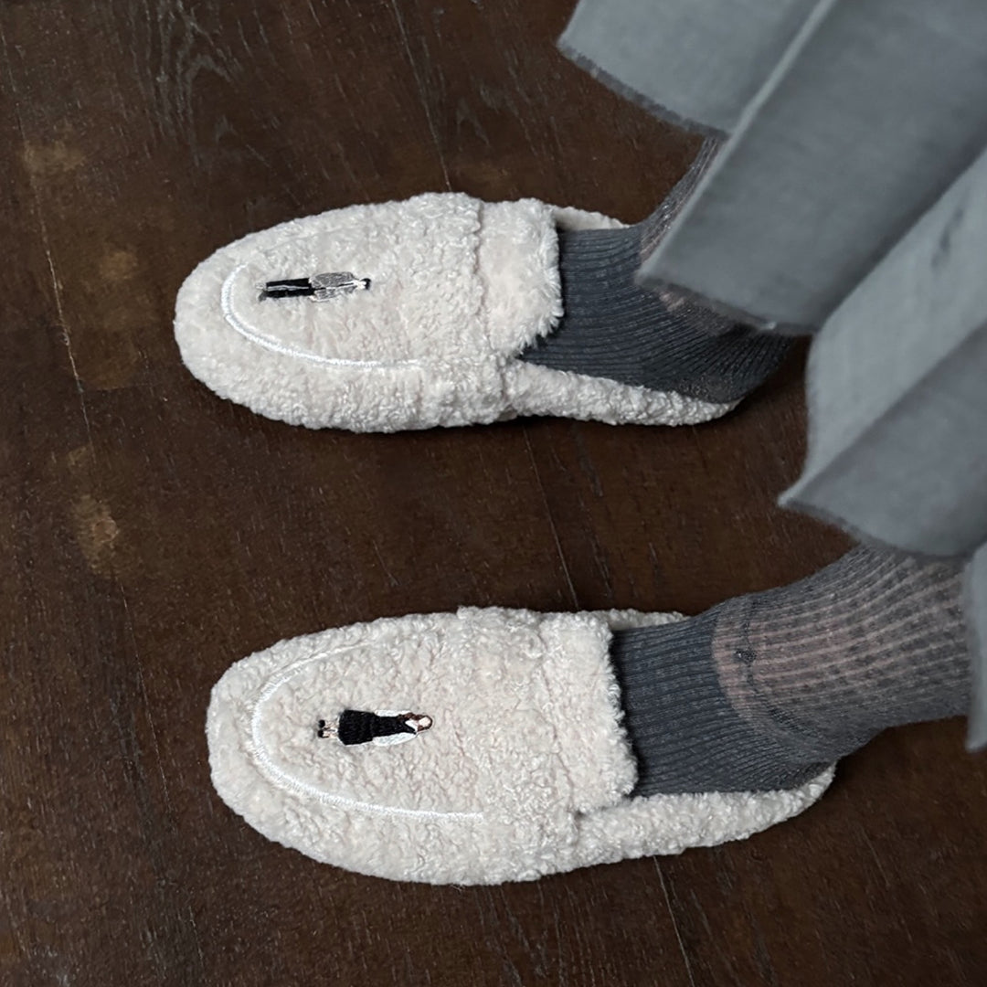 Beige shearling mules with embroidery patches