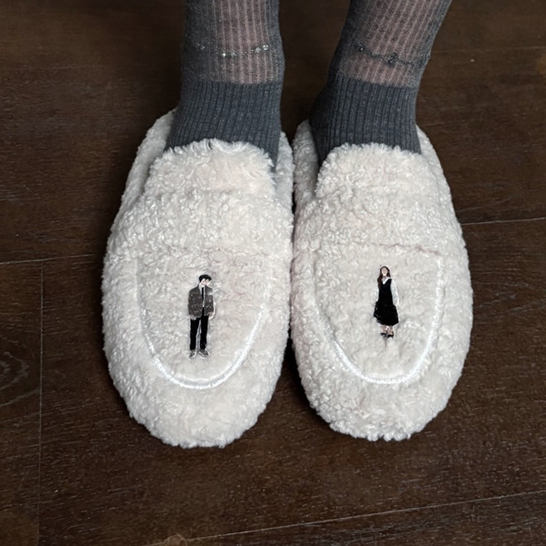 Beige shearling mules with embroidery patches