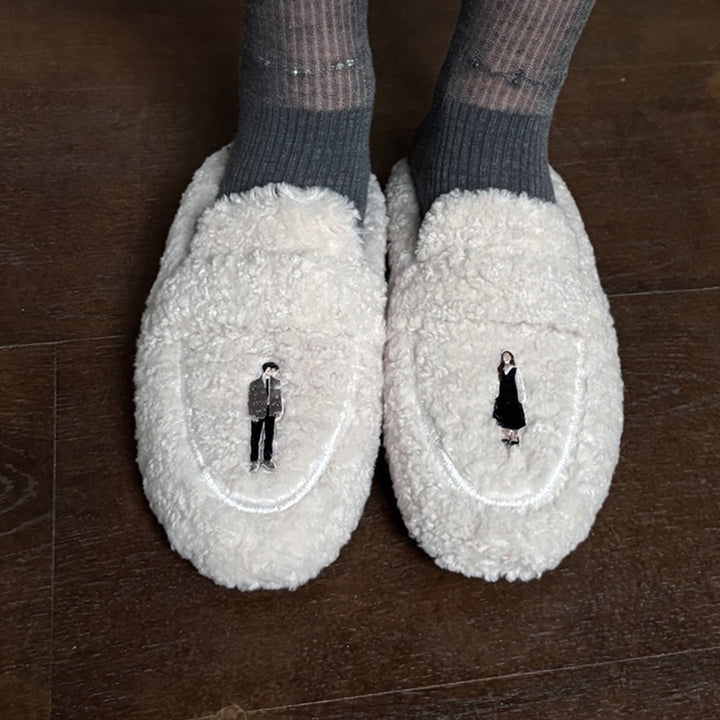 Beige shearling mules with embroidery patches