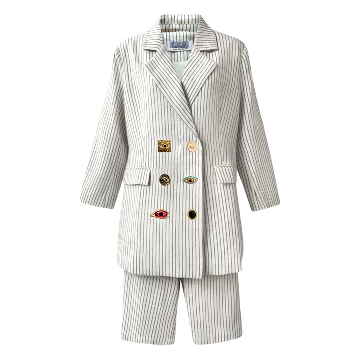 Ivory pin stripe linen double breasted suit with surrealist eye buttons