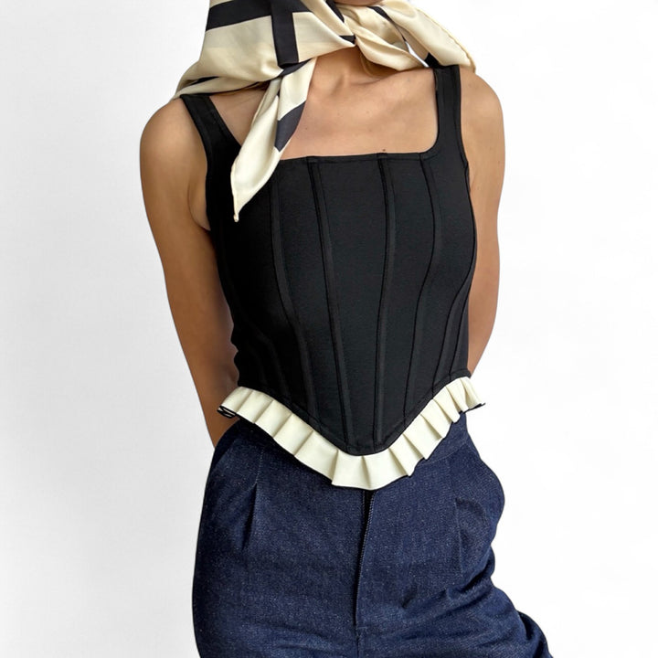 Black rib knit corset top with ruffle