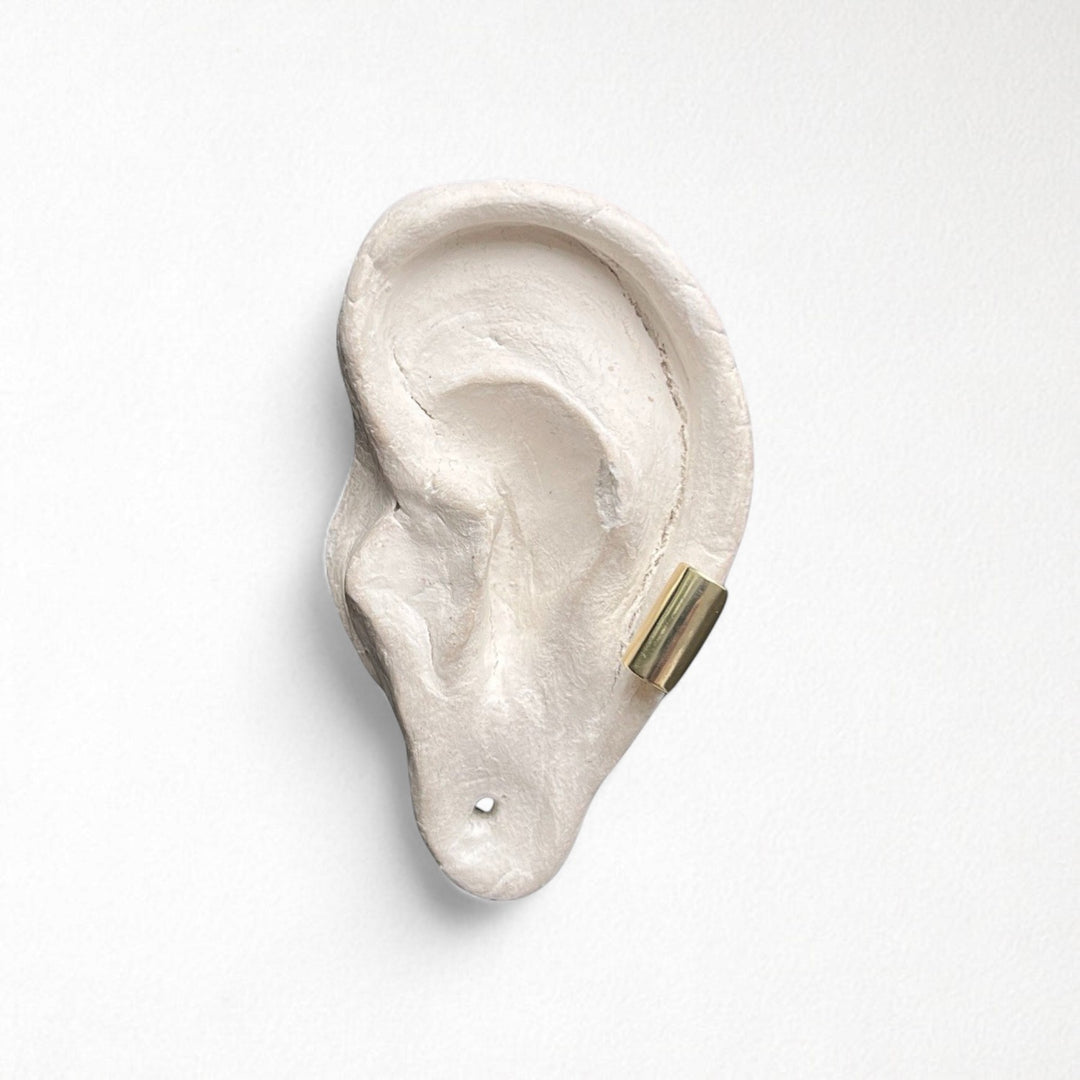 Gold earlobe cuff earring one piece