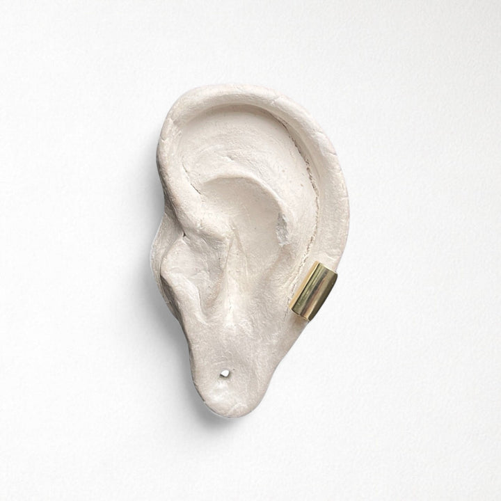 Gold earlobe cuff earring one piece