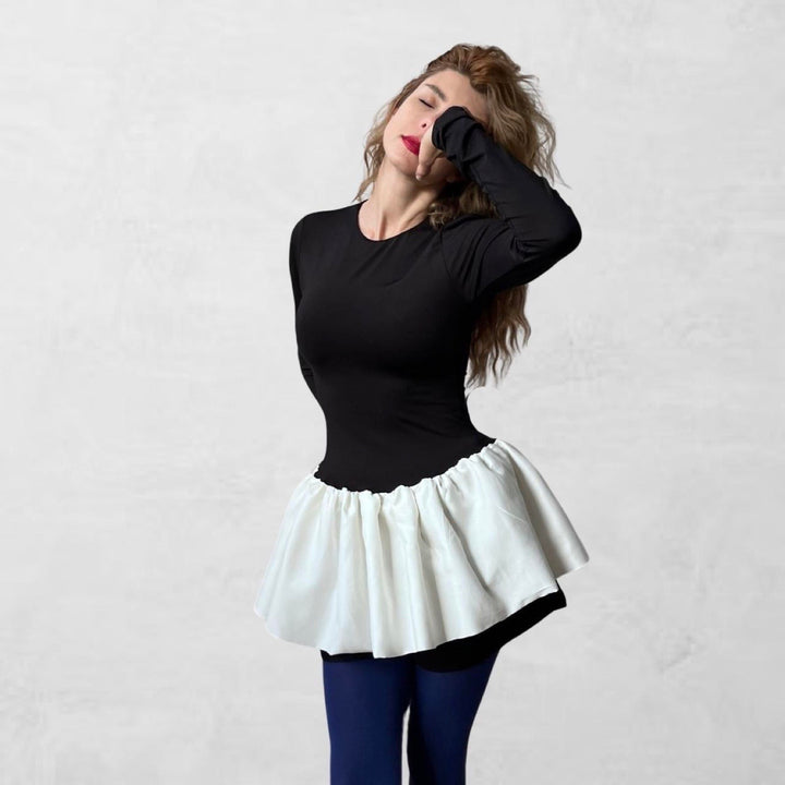 Black top with white balloon ruffle peplum