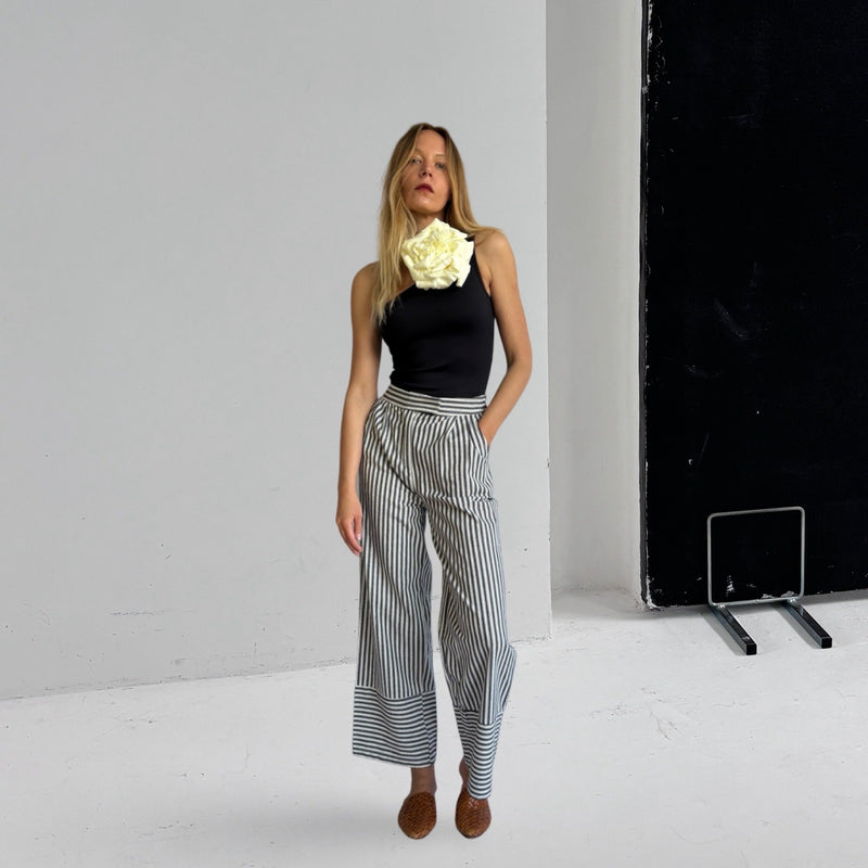 Black One Shoulder Top With White Flower Pin
