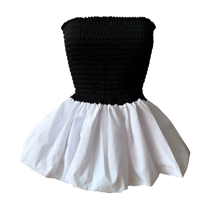 Black smocked top with white balloon peplum