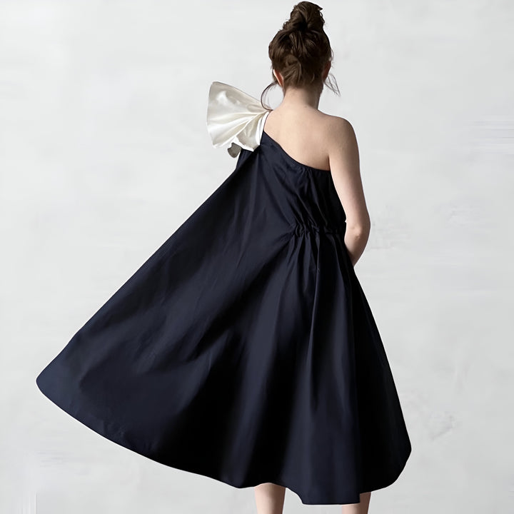 Navy cloche dress with one shoulder white bow