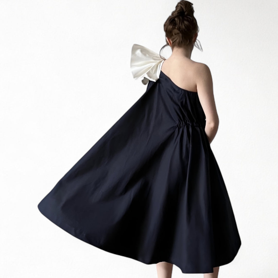 Navy cloche dress with one shoulder white bow
