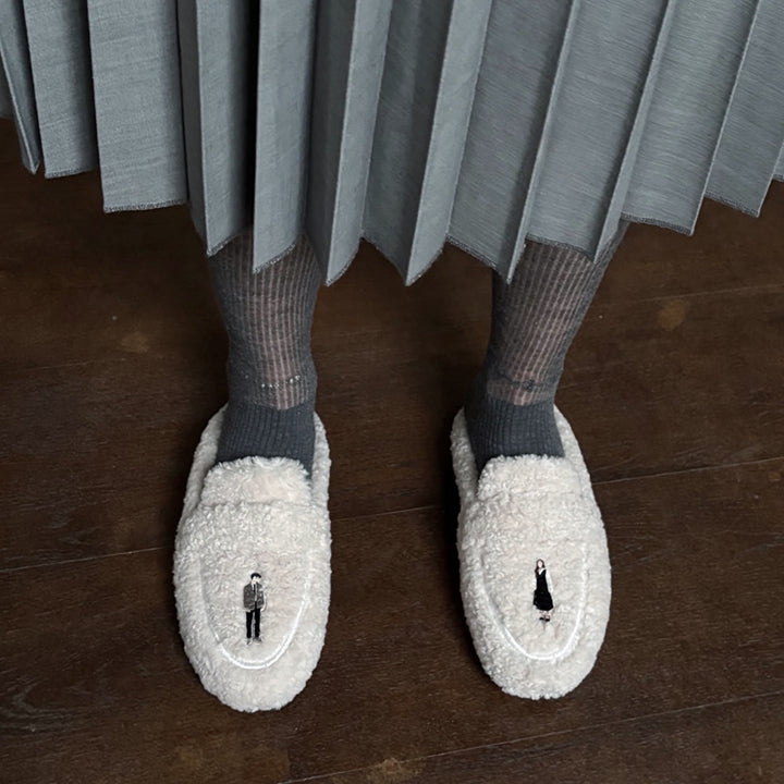 Beige shearling mules with embroidery patches