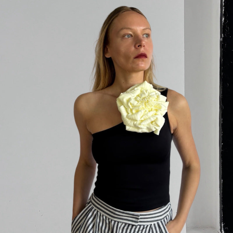 Black One Shoulder Top With White Flower Pin